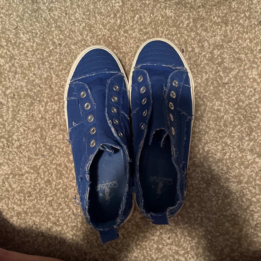 Cute tattered tennis shoes